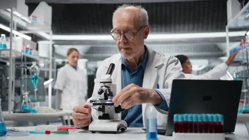 Senior Scientist Using Microscope in Modern Laboratory