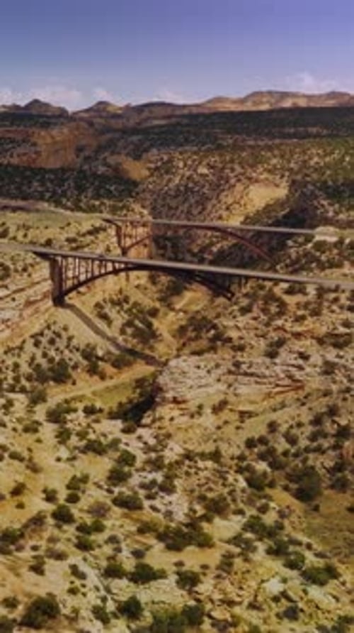 Flying close to the top of the rock in desert.