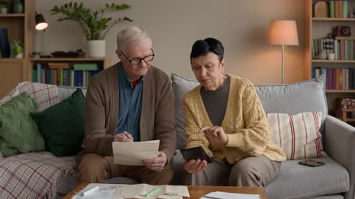 Senior Couple Paying Bills at Home