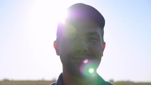 Portrait Smiling Farmer Businessman Standing in Wheat Field at Sunrise Farming