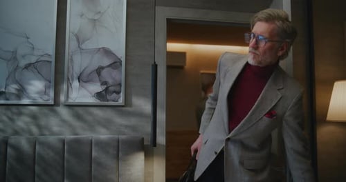 Gray Haired Man Has Arrived on Business Trip After Difficult Journey Checks Into Sunny Hotel Room