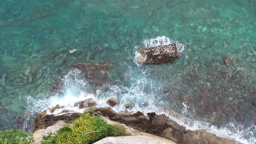 Aerial View Drone Camera Top Down of Seashore Rocks in Ocean Amazing Sea Waves Crashing on Rocks