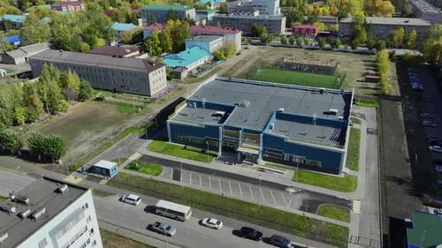 Residential Buildings Arranged in Neat Rows Along Road