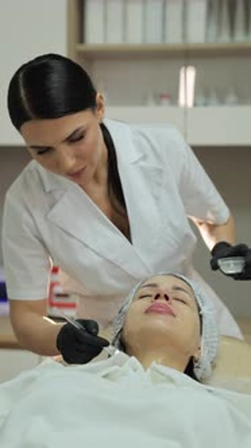 Woman Receiving a Facial Treatment at Medical Spa