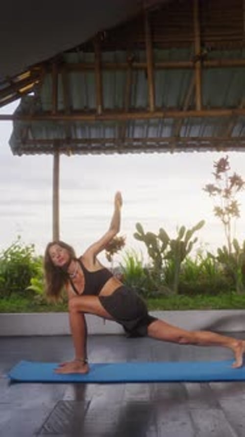 Yoga Exercises with View on Sunset Caucasian Fit Woman Doing Yoga Training on Seashore Healthy