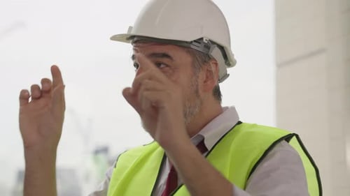 Senior engineer contractor holding tablet assigning