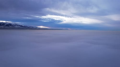 Flying Among the Clouds with a View of Mountains