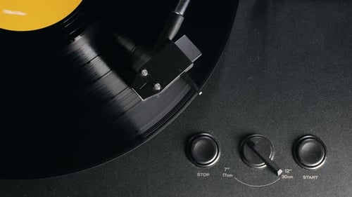 Spinning Vinyl Record on Black Record Player