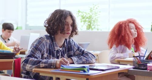 Focused Students Working on School Assignments