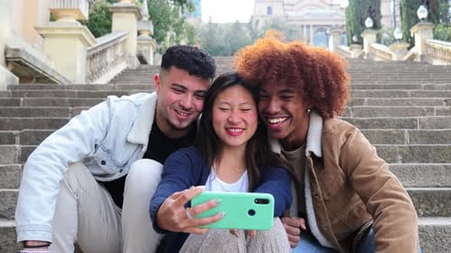 Three Young Adults Taking a Selfie