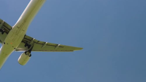 Commercial Airplane Landing Approach in Clear Blue Sky