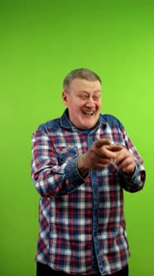 Man Laughing and Pointing on Green Screen