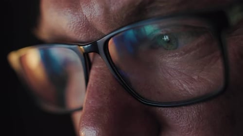 Adult with Glasses, Monitor Reflection, Close-up