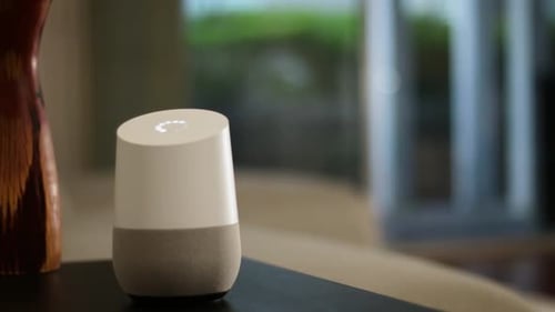 Smart Speaker Displaying Changing Colors Inside Home