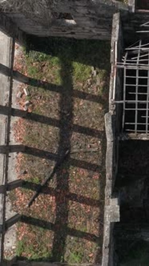 Fly above abandoned houses vertical video