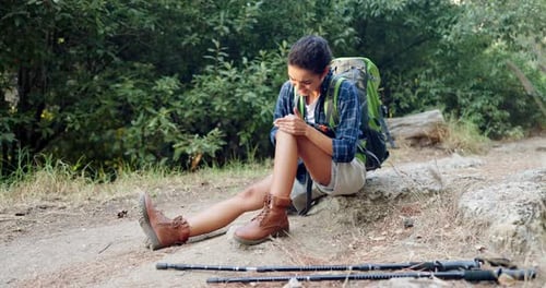 Woman Injured on Hike Grabs Knee in Pain