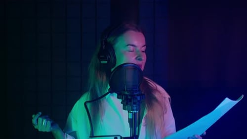 Woman Voice Actor Working in Recording Studio