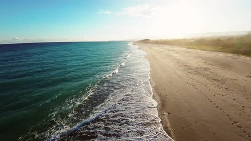 Calm Ocean Waves on Sandy Beach