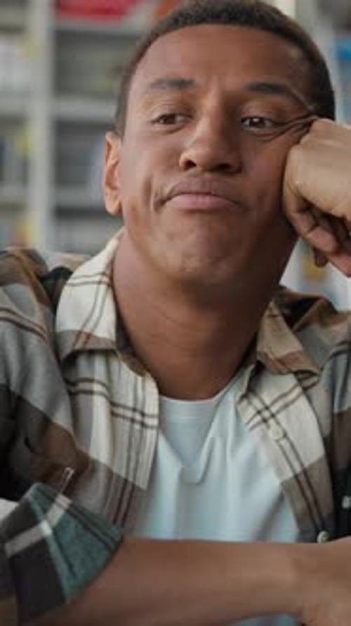 Pensive Thoughtful African American Man Male Student in Library Leaning Hand Sad Bored Guy Thinking