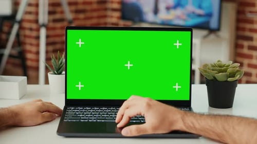 Male Freelancer Working on Laptop with Green Screen Template