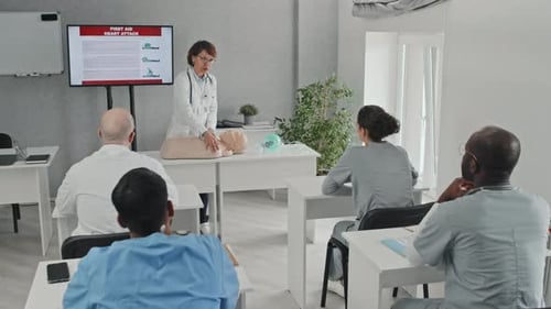 Medical Professionals Learning CPR in a Classroom