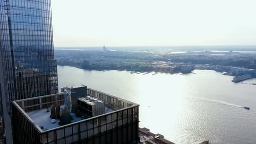 Aerial view over Hudson yards skyscrapers, towards the cityscape of Jersey and the river