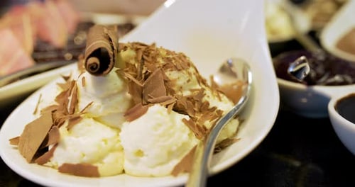 Close Up Of Fresh Ice Cream Dessert Sprinkled With Chocolate