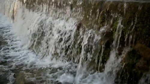 Catching a waterfall in a small freshwater channel.