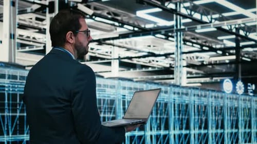 Data Center Software Developer Writing Code Optimization Using Laptop