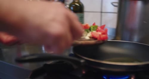 Adding Tomatoes, Cheese, and Basil to Frying Pan