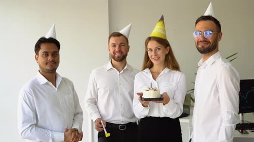 Business Team Celebrating a Birthday of Collegue in the Modern Office