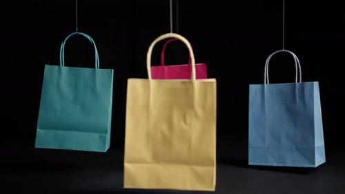 Colorful Shopping Bags Hanging with Black Friday Sale Sign