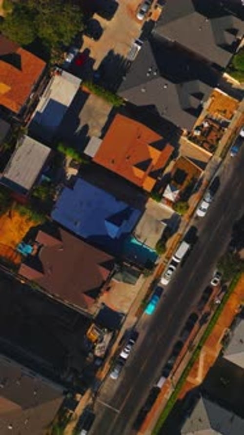 Flying over the roofs and streets of sunny Los Angeles.