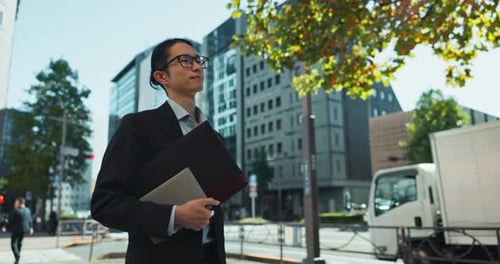 Walking, city and Asian business man with tablet, documents and file for morning commute in urban