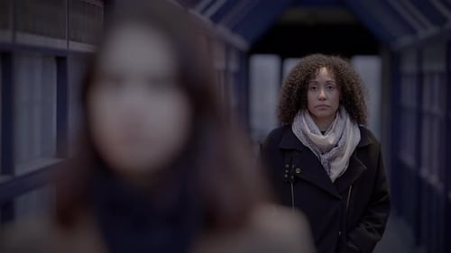 Lifestyle Portrait of Two Young Women Watching Tower Building Together