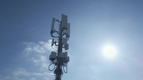 A Telecommunication Tower Standing Tall Against a Beautiful Clear Blue Sky Above