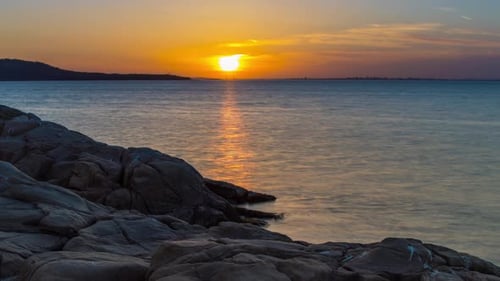 A Beach with Sand and Stones Near the Black Sea Under Sunset Light in Bulgaria