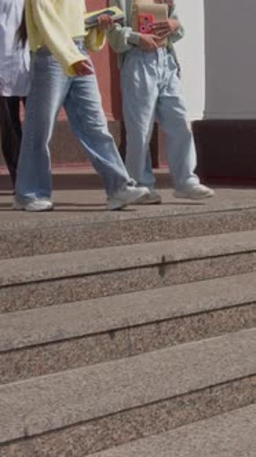 Happy Teenagers Chatting and Ascending School Staircase Outside