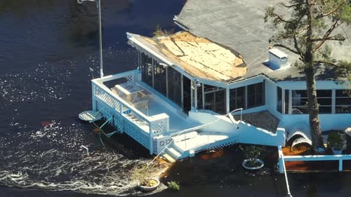 Surrounded By Hurricane Ian Rainfall Flood Waters Home in Florida Residential Area