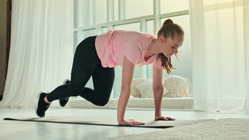 Young Woman Doing Core Exercise
