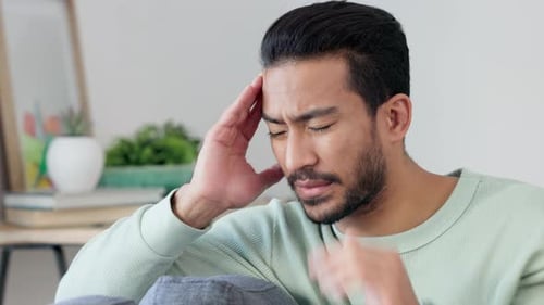Man Suffering Headache Indoors