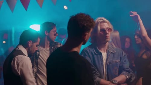 People Enjoying Music and Dancing at Birthday Party