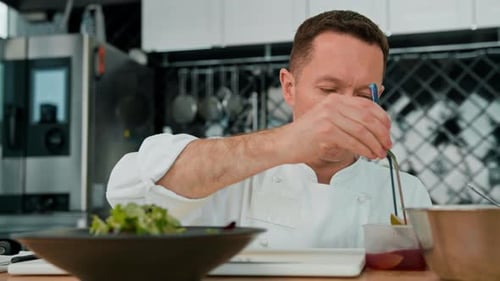 Chef Prepares Food With Precision in Kitchen