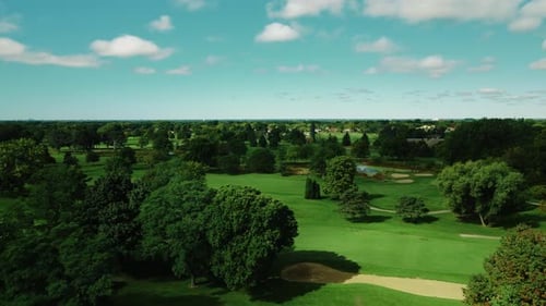 Aerial drone forward moving shot of huge golf club featuring a full 18 hole golf course in Northbroo