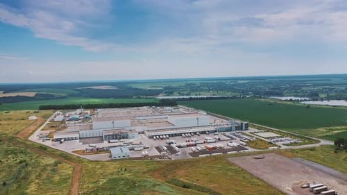 Aerial footage of a large industrial complex. Modern Factory Exterior.