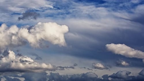 Timelapse of Dramatic Clouds Moving Across a Blue Sky