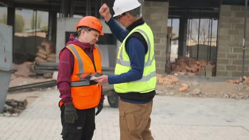 Contractor scolds worker for poor quality construction project progress