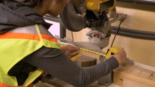 Slow Motion Carpenter Measures Wooden Block