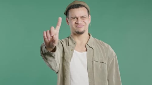 Serious African Man Showing Rejecting Gesture By Stop Finger Sign Dont Allow