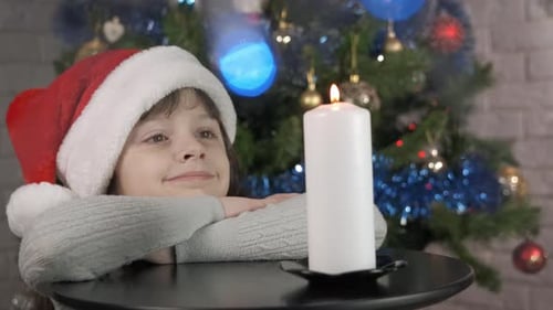 Little Santa By Burning Candle
